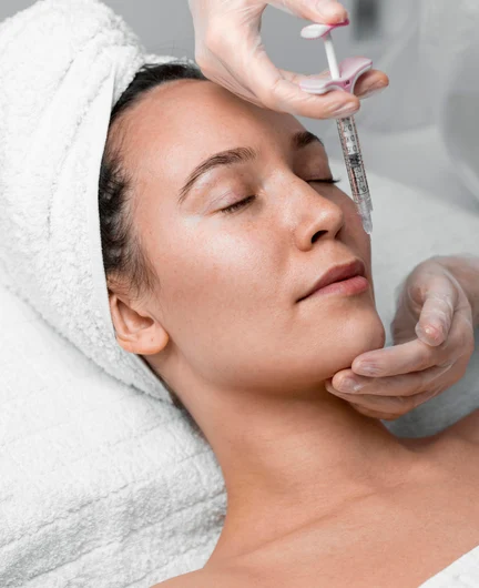 1b145e26-2b8e-4846-a54b-7ba71c35f62b-beautician-doing-filler-injection-female-client.jpg